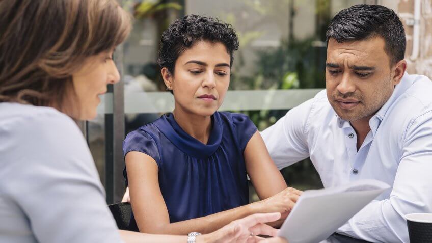 Serious mature couple receive professional advice.