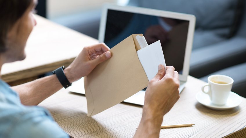 guy opening up letter