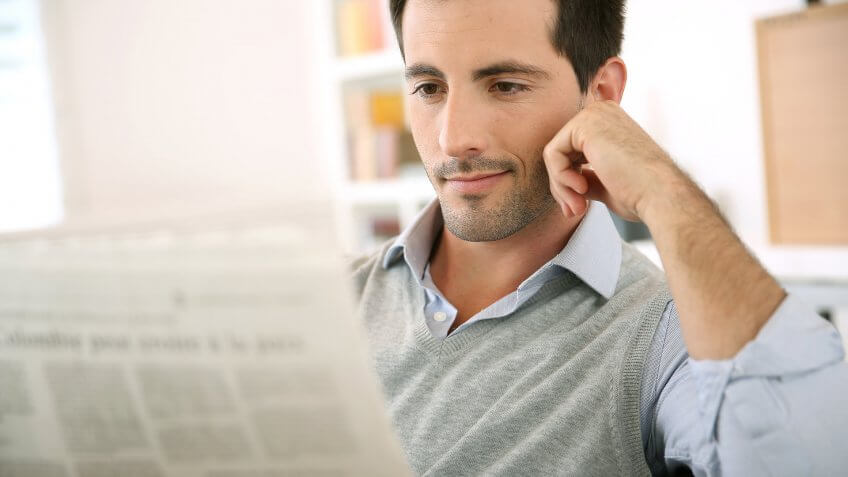guy reading newspaper