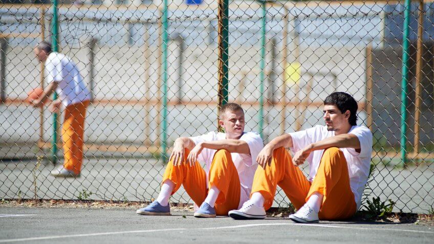 Prisoners communicating during walk.