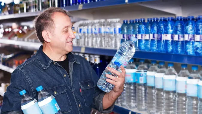 man buying bottled water