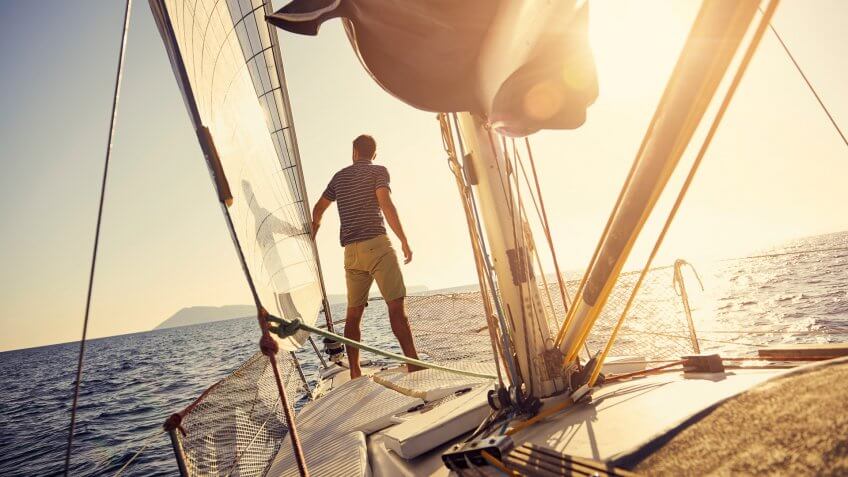 Shot of a young man out sailinghttp://195.