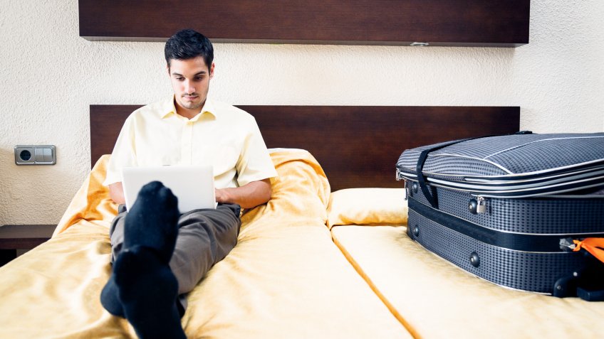man working in hotel room