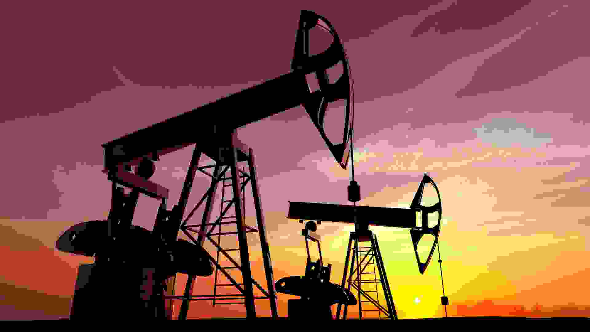 Oil pump against sunset sky