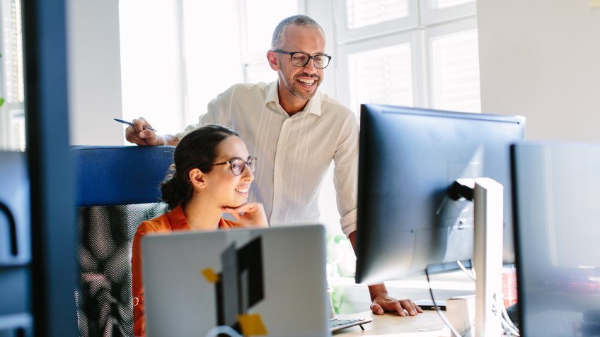 Computer programmers working together