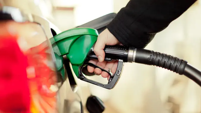 woman pumping gasoline