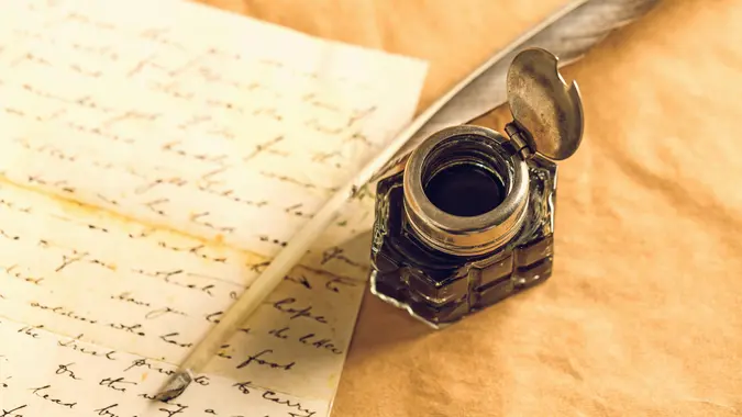Feather pen into the inkwell.