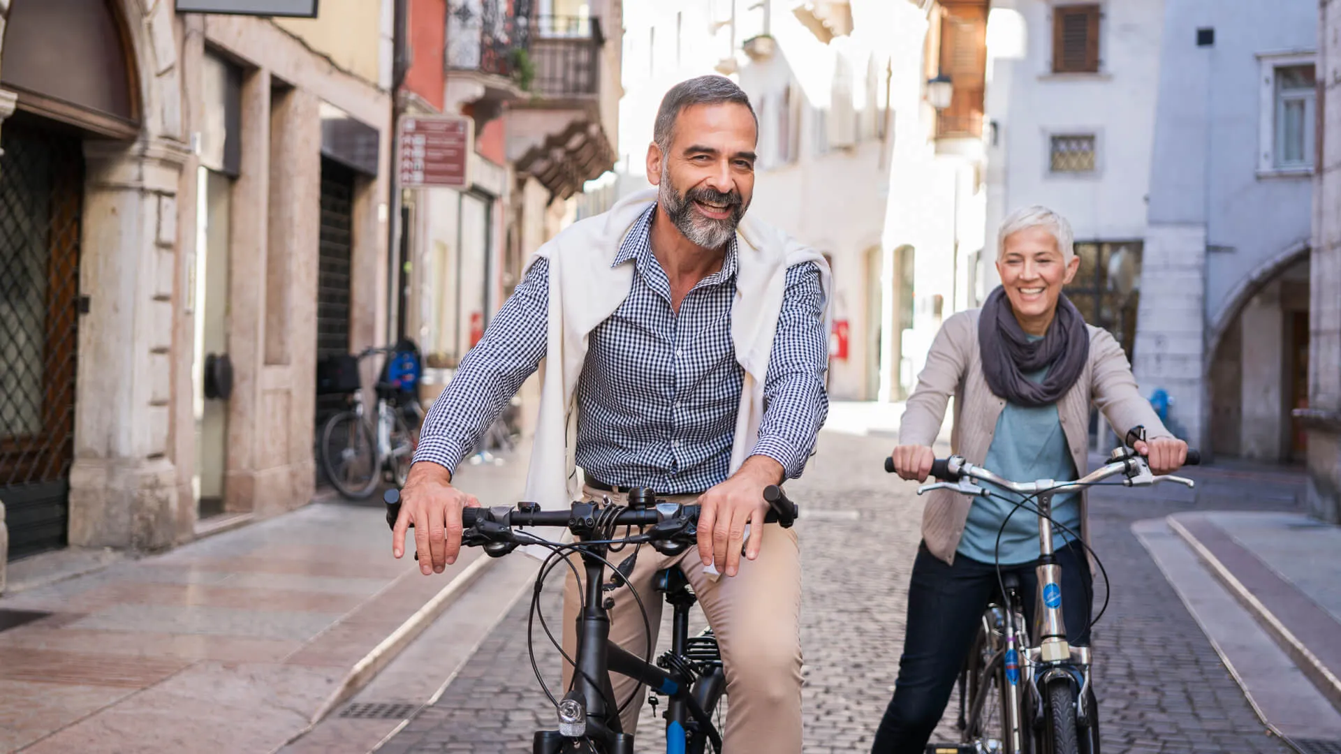 Mature couple exploring city with bicycle's.