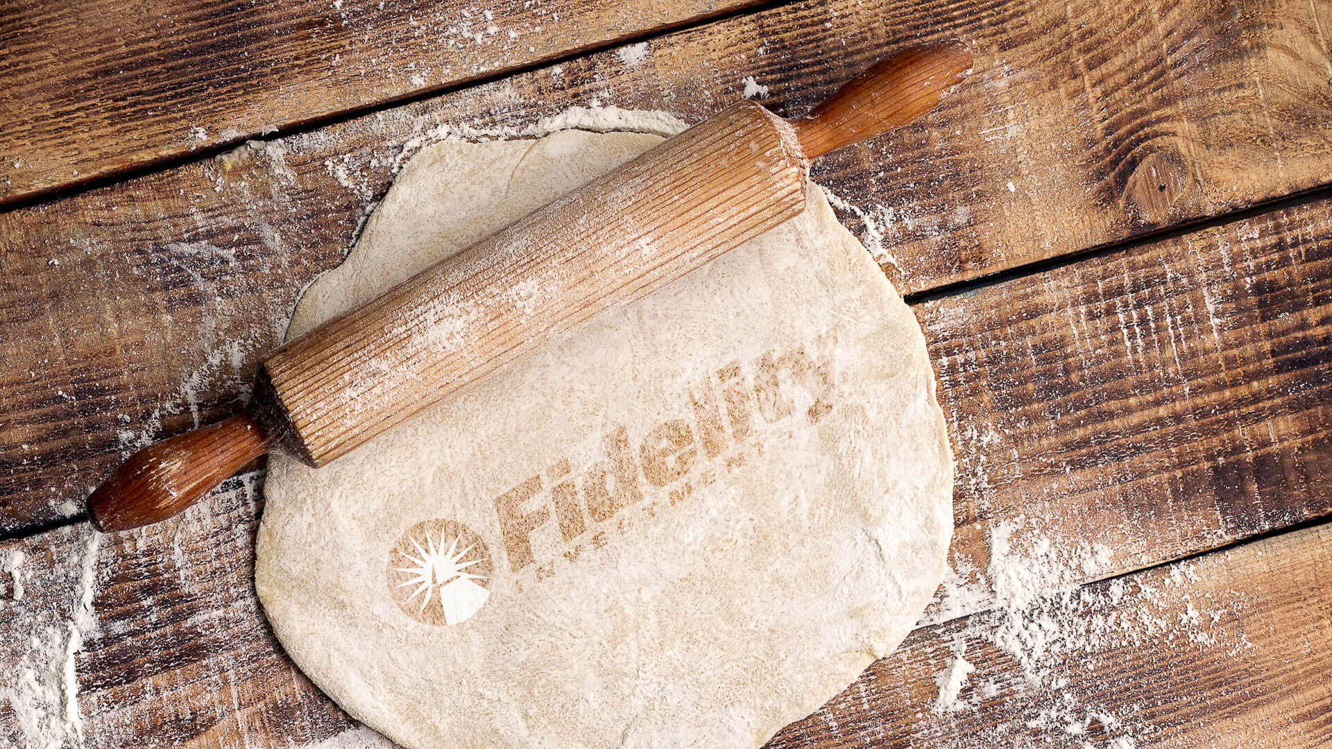 Fidelity Investments rolling pin with dough
