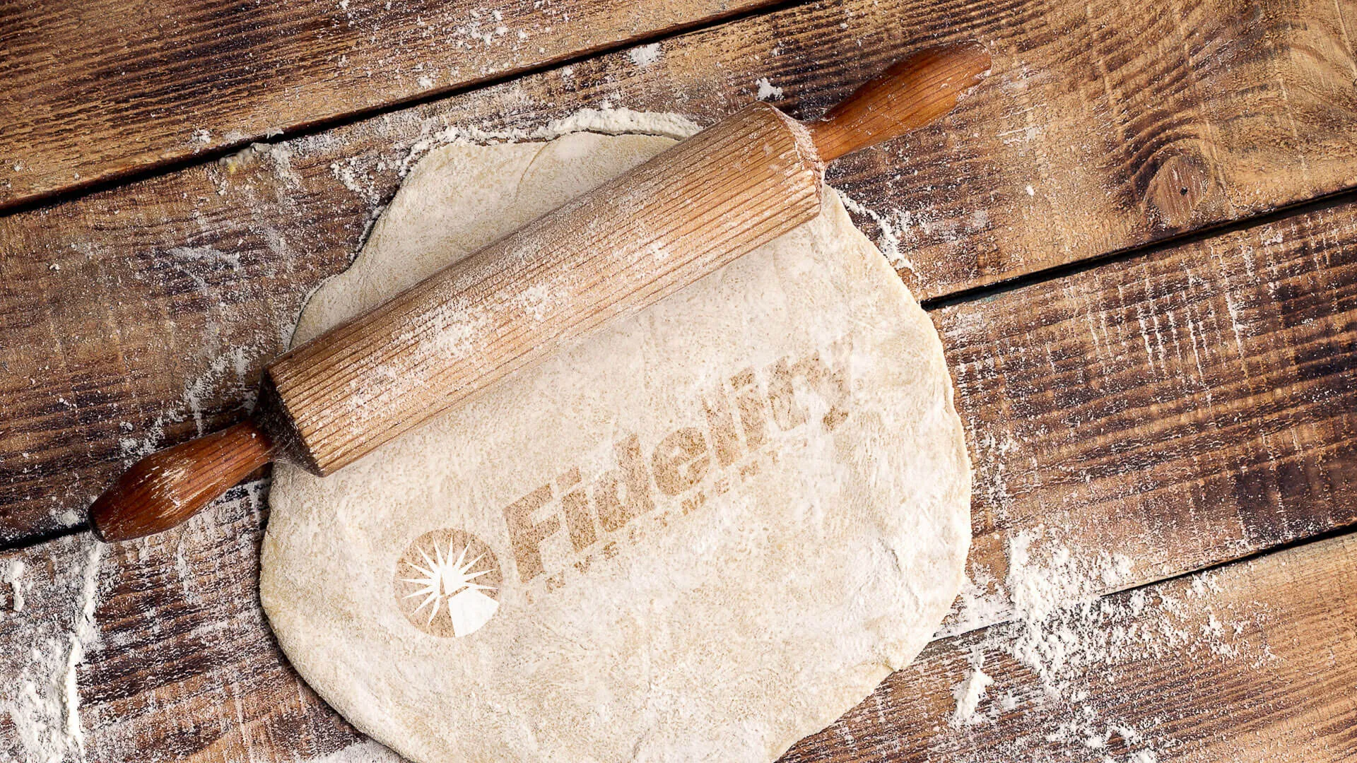Fidelity Investments rolling pin with dough