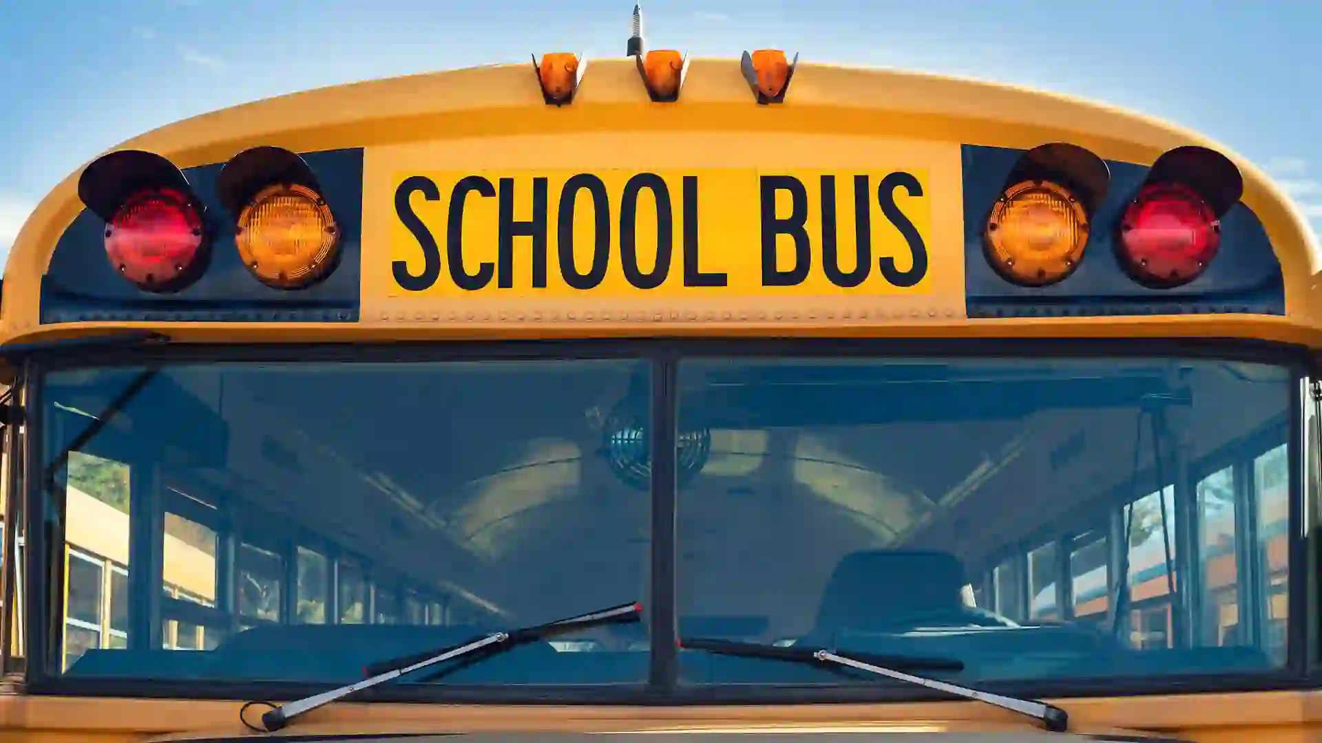 Front closeup view of a yellow school bus.
