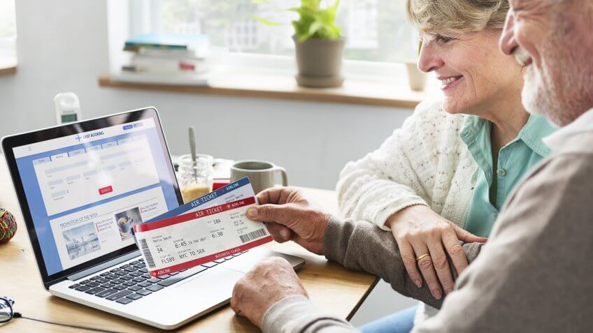 senior people with airplane tickets