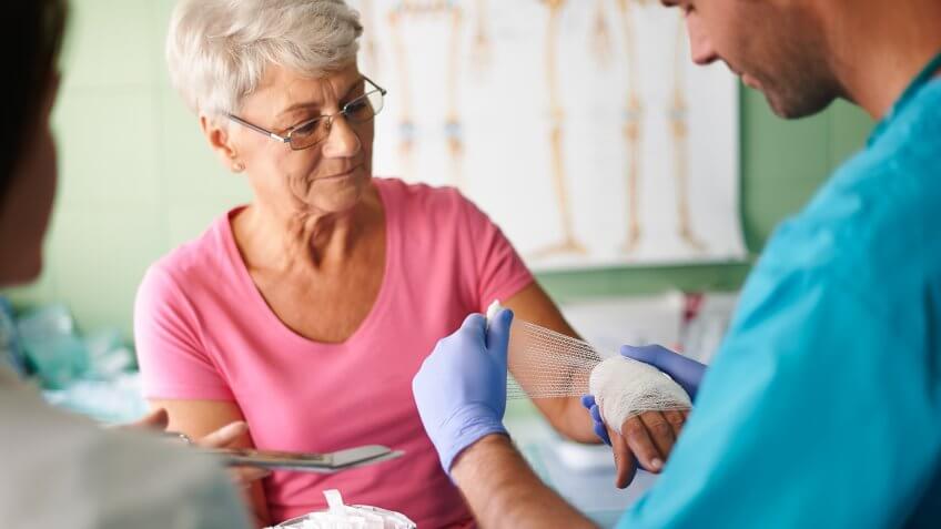 Senior woman with bandage on the hand.