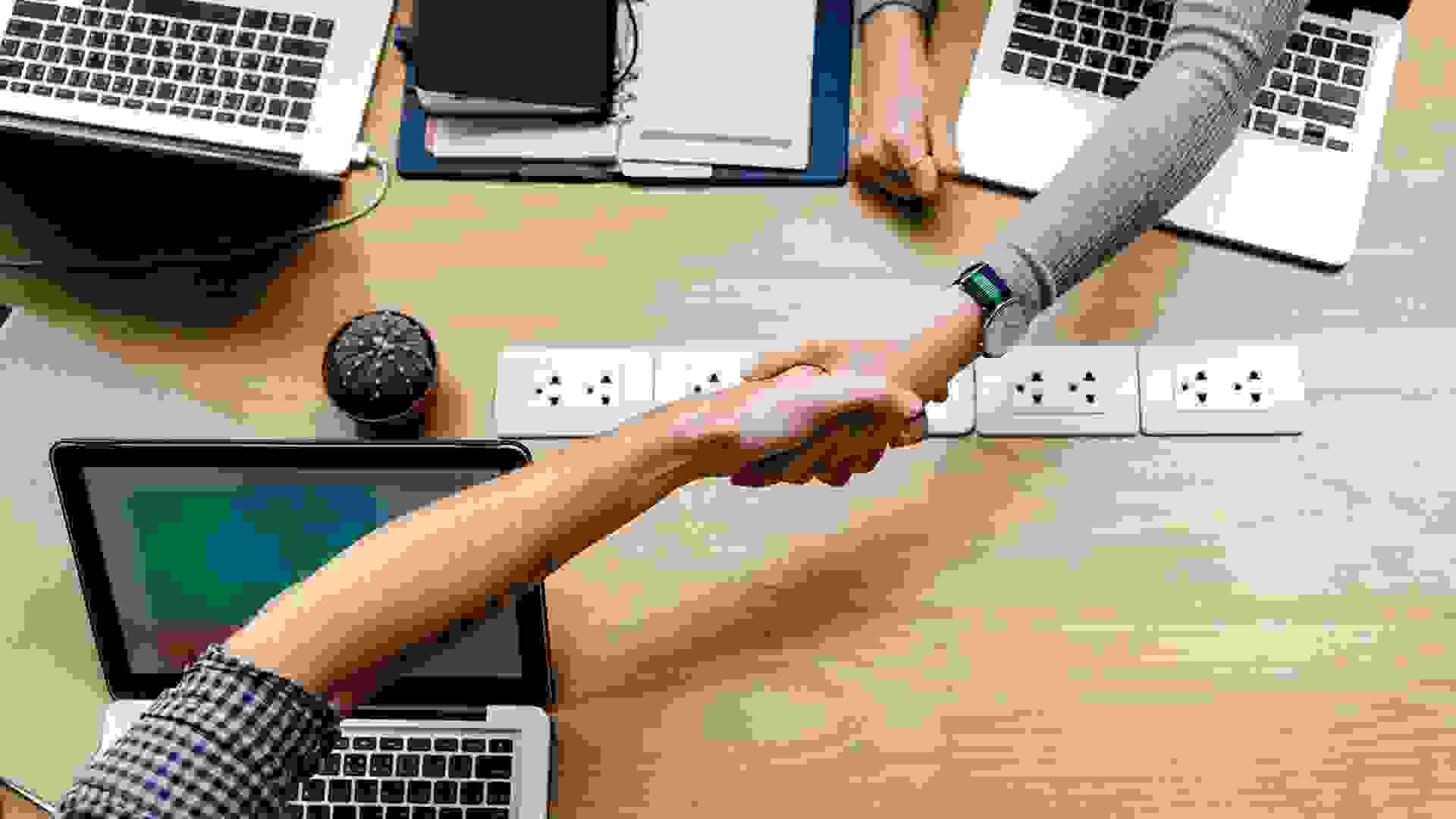 shaking hands at office.