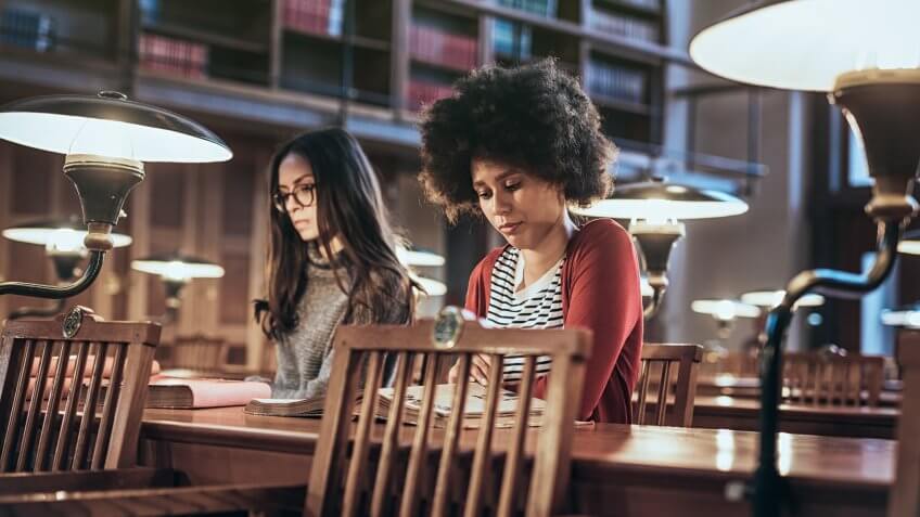 Students studying at libraryStudents studying at library.