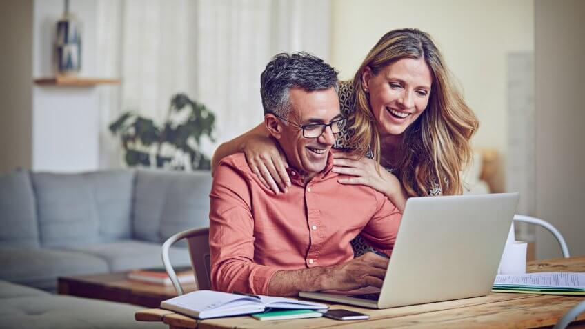 Mature couple using a laptop