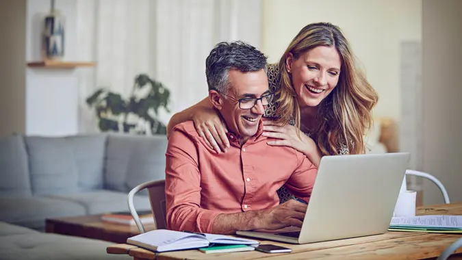 Mature couple using a laptop