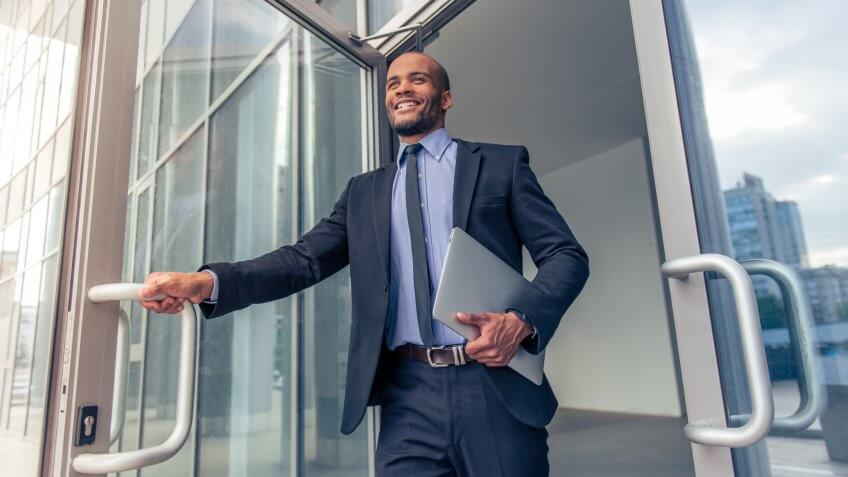 Businessman leaving office for the day