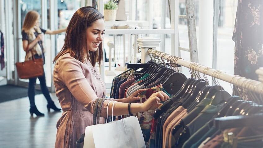 woman shopping at a clothing store.