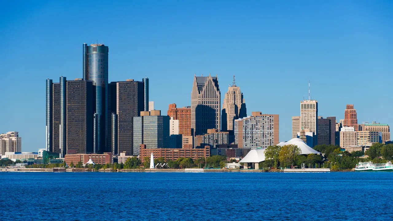 Downtown Detroit closeup skyline view with Detroit River in the foreground.