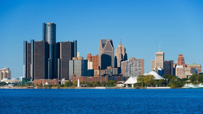 Downtown Detroit closeup skyline view with Detroit River in the foreground.