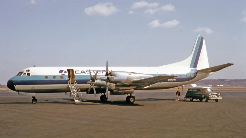Eastern Airlines Lockheed L-188A Electra airplane being serviced for flight.