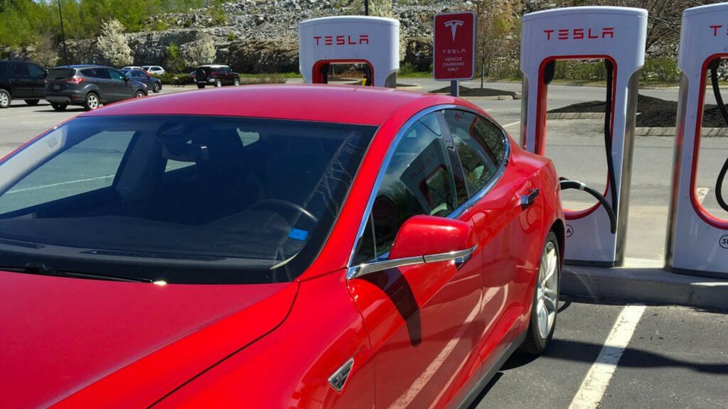 Influencer red tesla charging station Jordann Brown