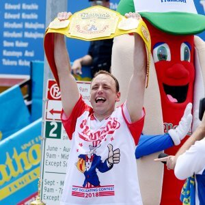 Mandatory Credit: Photo by Erik Pendzich/REX/Shutterstock (9735357ag) Joey Chestnut eats 74 hot dogs in 10 minutes Nathan's Famous Fourth of July Hot Dog Eating Contest, New York, USA - 04 Jul 2018.