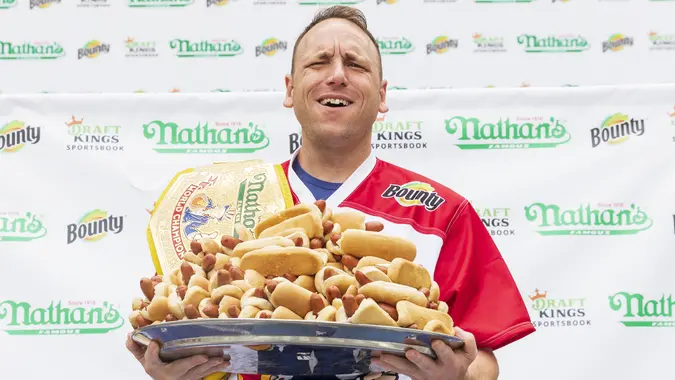 Mandatory Credit: Photo by JUSTIN LANE/EPA-EFE/Shutterstock (12193787d)Competitive eater Joey Chestnut holds up a plate of hot dogs during a weigh-in ceremony for competitive eaters taking part in this year's 2021 Nathan's Famous Hot Dog Eating Contest in New York, New York, USA, 02 July 2021.