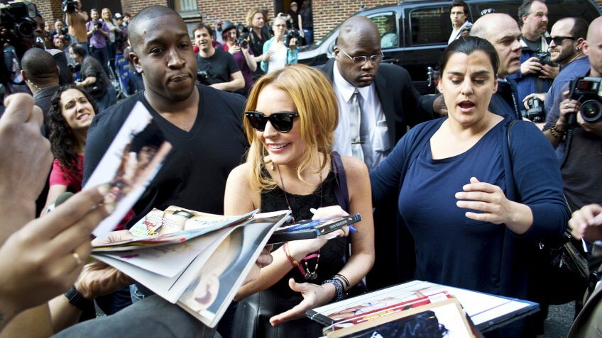 NEW YORK - APRIL 9: Lindsay Lohan greets fans after her David Letterman appearance outside the Ed Sullivan Theater on April 9, 2013 in Manhattan.