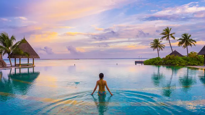 girl in the swimming pool in maldives resort.