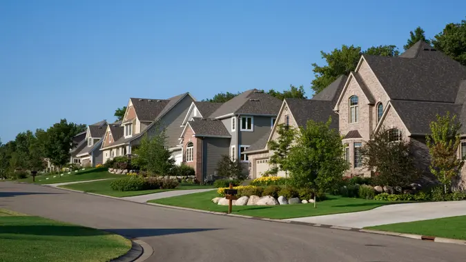 Nice upscale homes on suburban street.
