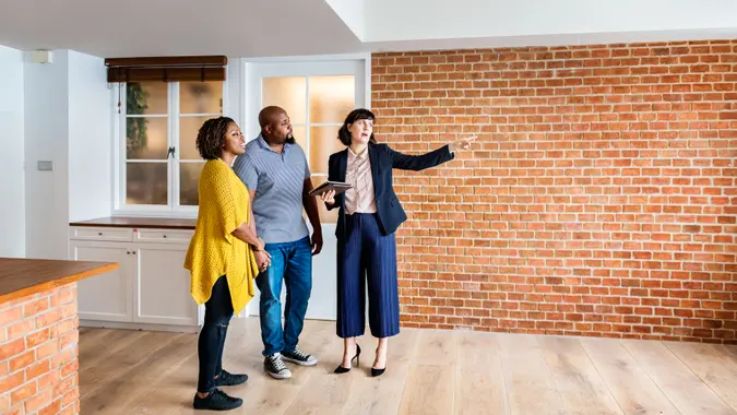 Property real estate manager showing tenants a new home