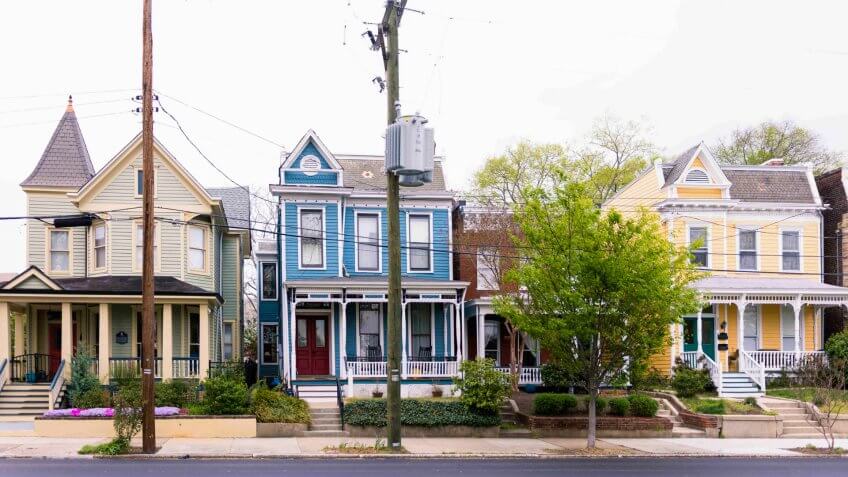 Street of bright painted colornial style homes in Richmond Virginia, USA.