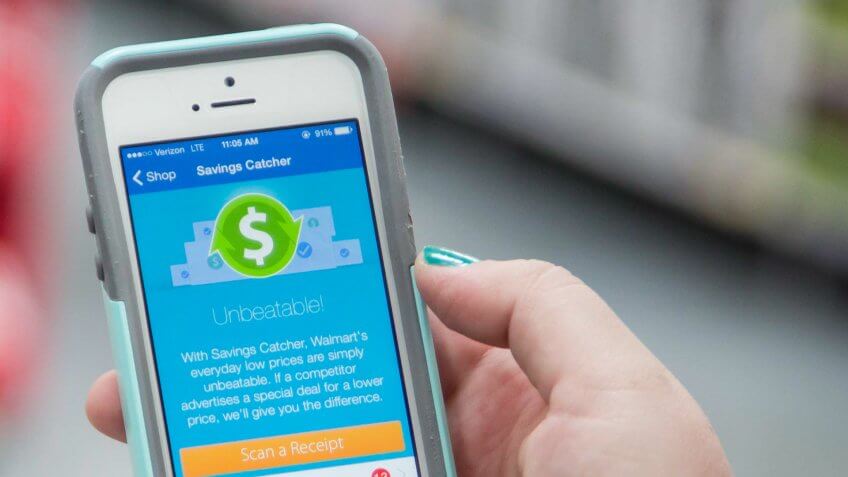 woman using the Walmart Savings Catcher App