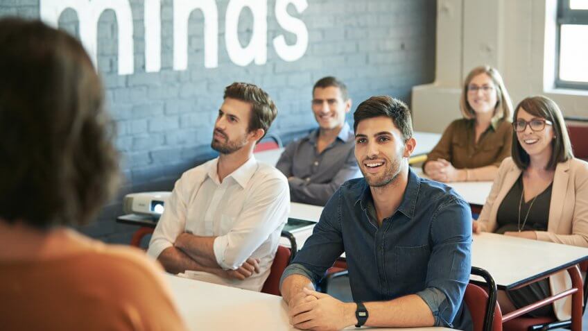 Shot of a group of businesspeople sitting in the boardroom during a presentation.