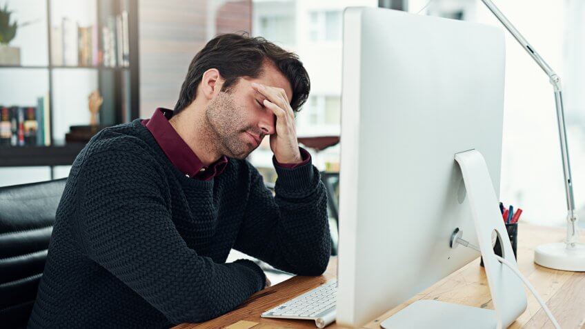 young businessman looking dismayed