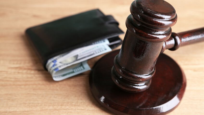 gavel with wallet and money