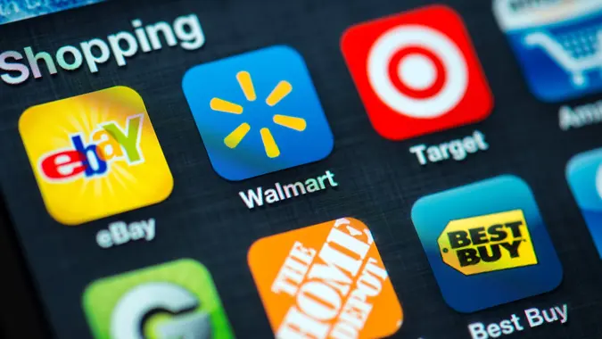 "Portland, Oregon, USA - August 17, 2012: A close up of an Apple iPhone 4s screen showing various Shopping apps, including eBay, Walmart, Target, Amazon, Groupon, Home Depot, Best Buy.