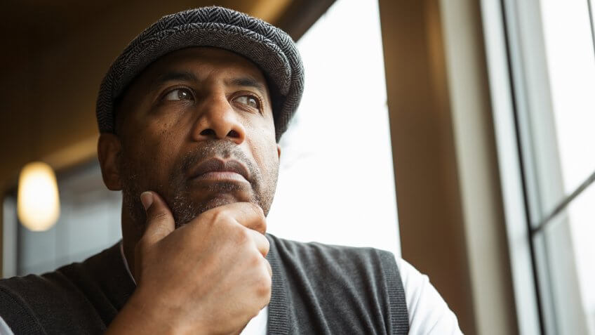 Mature African American man in deep thought.