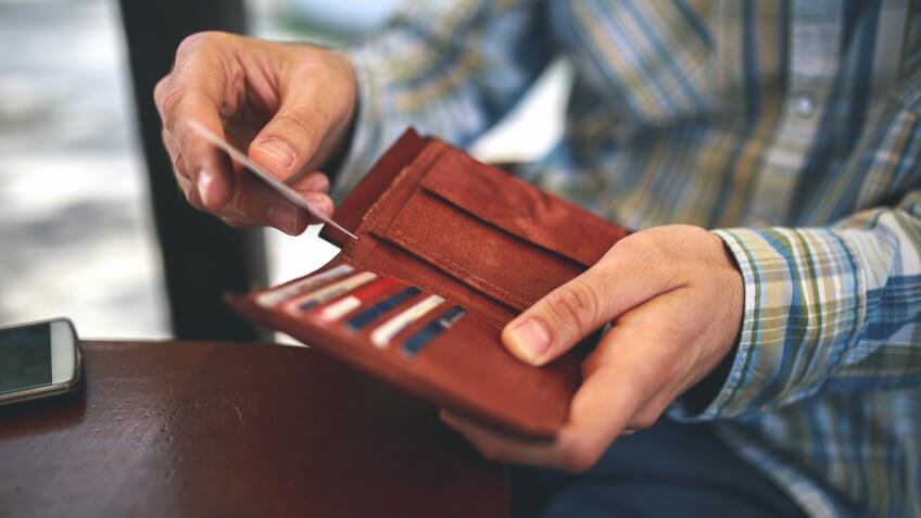 Man buys with a credit card.