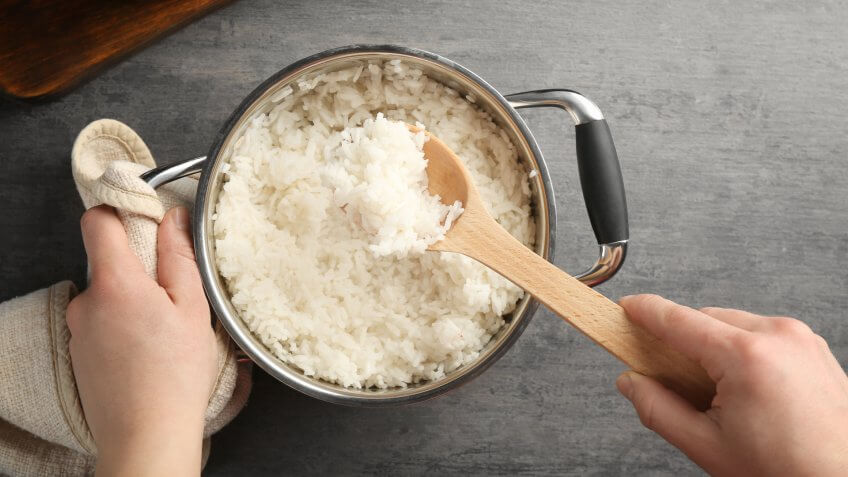 person making white rice