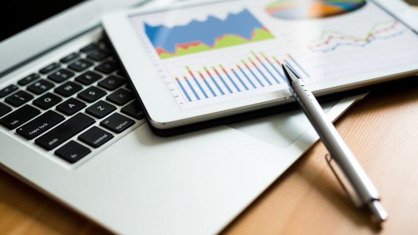 tablet with graph chart and pen