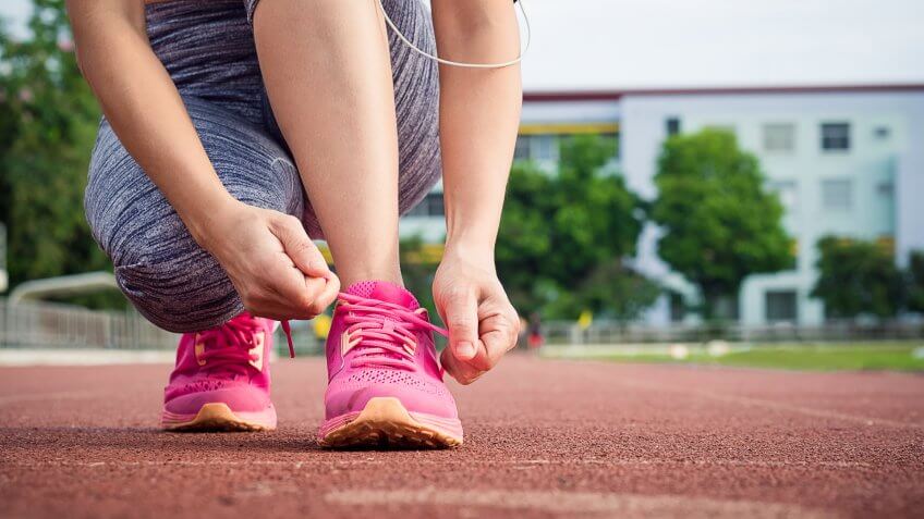 tying running shoes