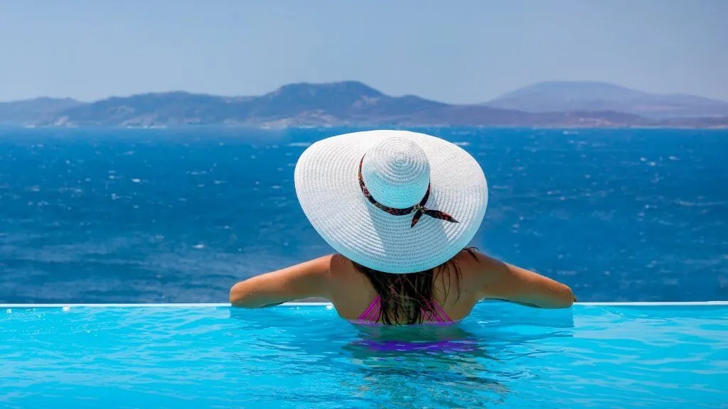 woman enjoying view from Mykonos infinite pool
