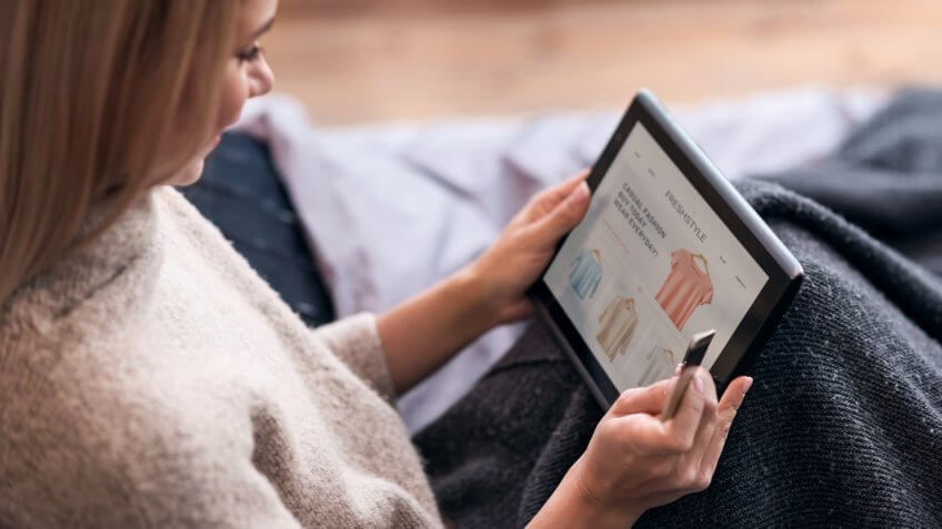 woman shopping on tablet