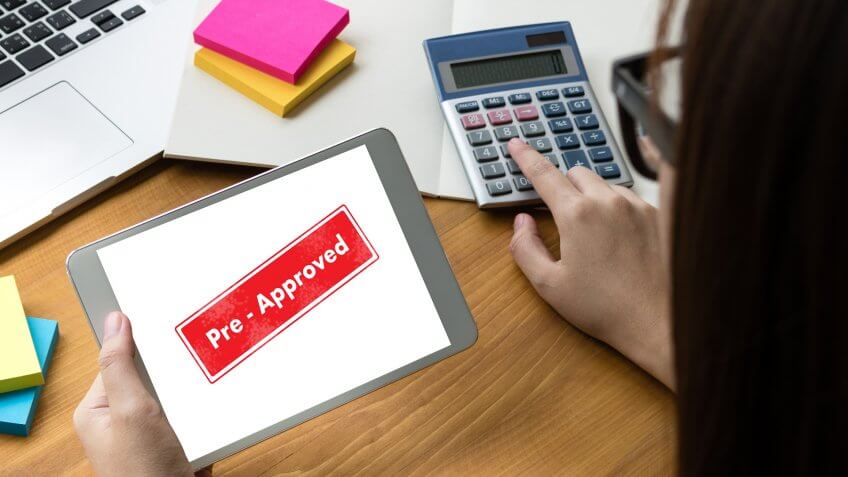 woman getting pre-approved on a tablet