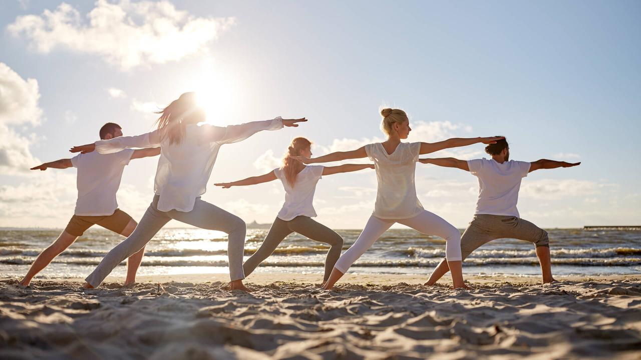 yoga class on the beach