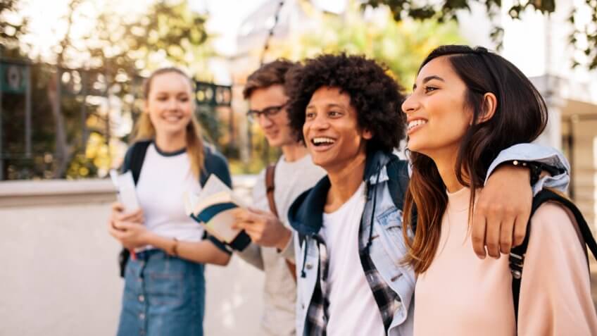 College students walking together outdoors.