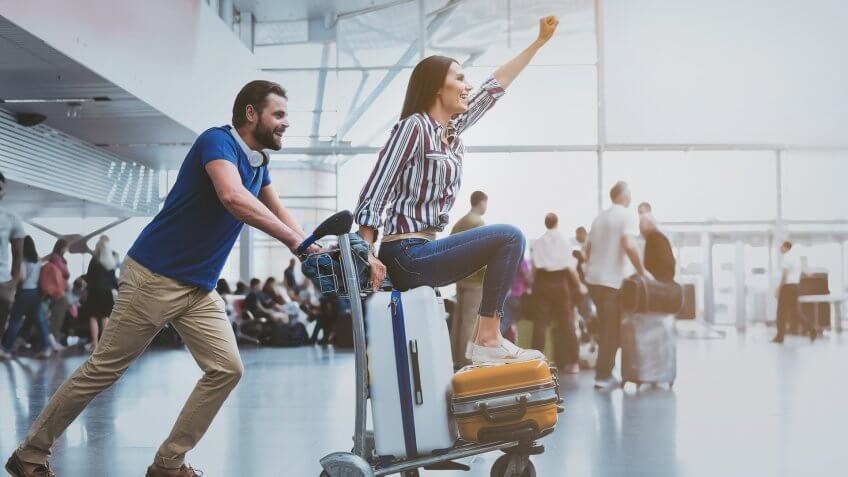 young couple traveling in international airport